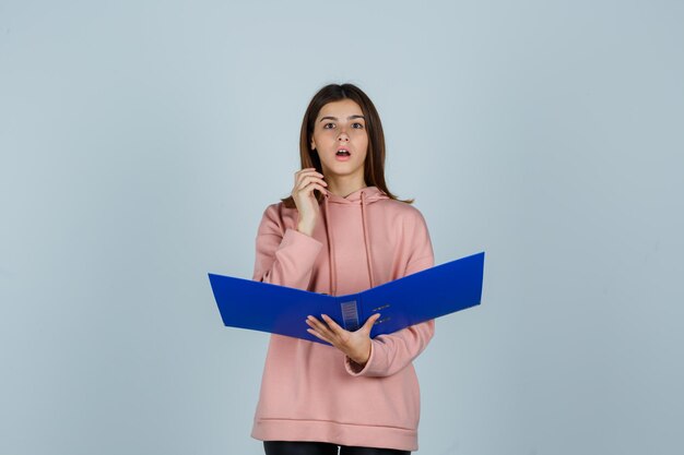 Expressive young lady posing in the studio