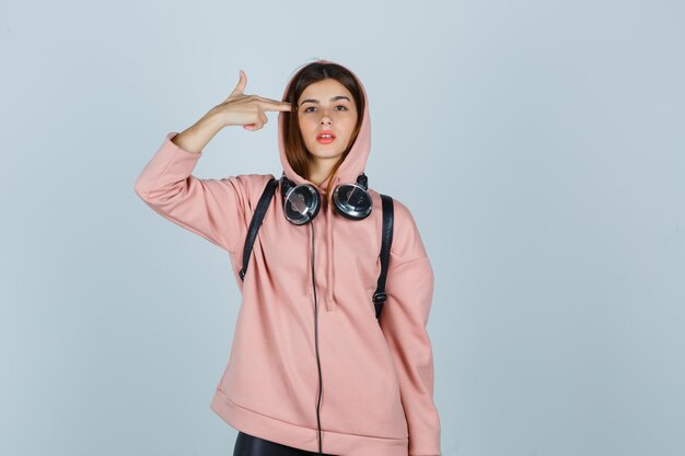 Expressive young lady posing in the studio