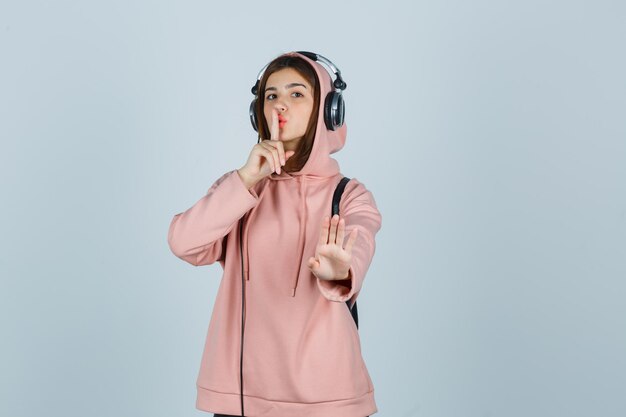 Expressive young lady posing in the studio