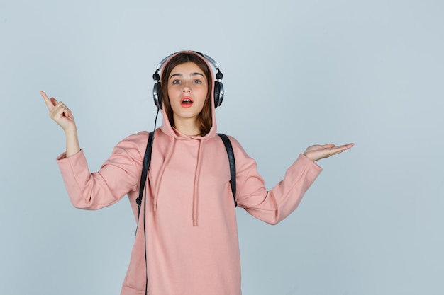 Expressive young lady posing in the studio