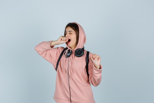 Expressive young lady posing in the studio