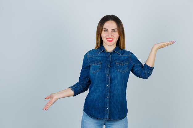 Expressive young lady posing in the studio