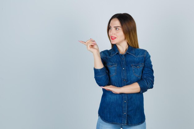 Expressive young lady posing in the studio