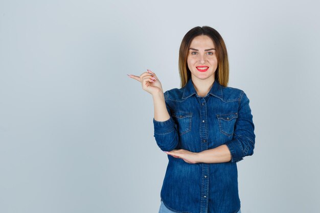 Expressive young lady posing in the studio