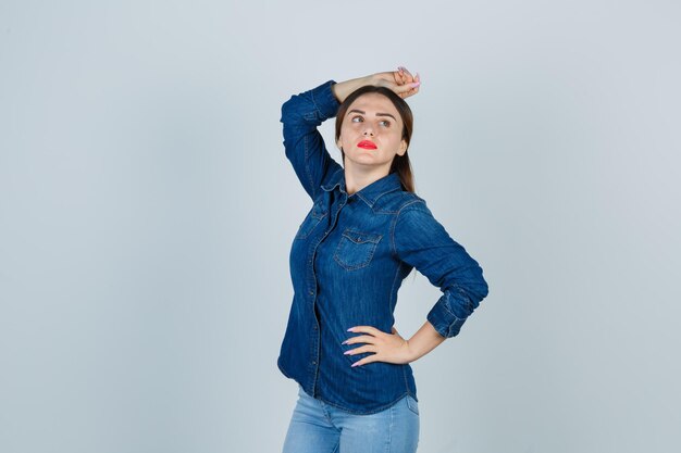 Expressive young lady posing in the studio