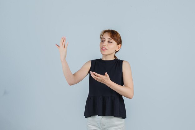 Expressive young lady posing in the studio