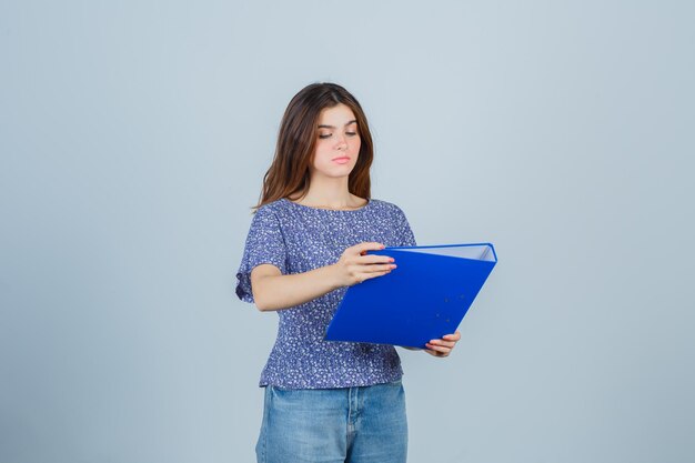 Expressive young lady posing in the studio