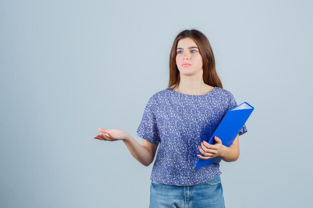 Expressive young lady posing in the studio