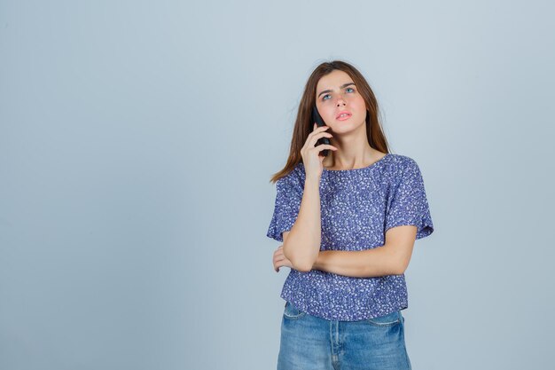 Expressive young lady posing in the studio