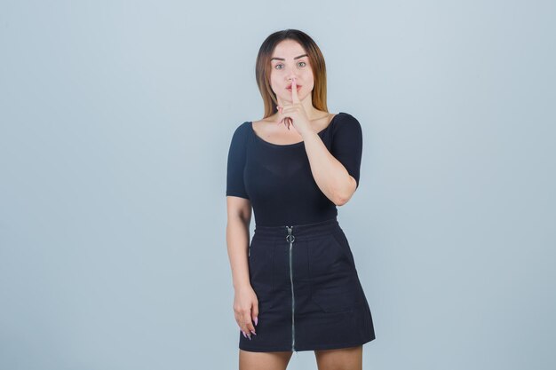 Expressive young lady posing in the studio