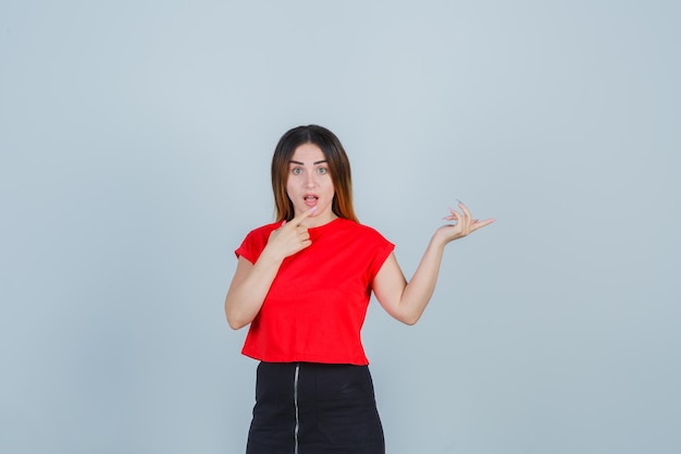 Expressive young lady posing in the studio