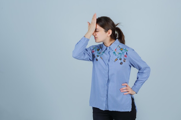 Expressive young lady posing in the studio