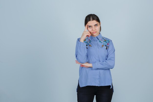 Expressive young lady posing in the studio