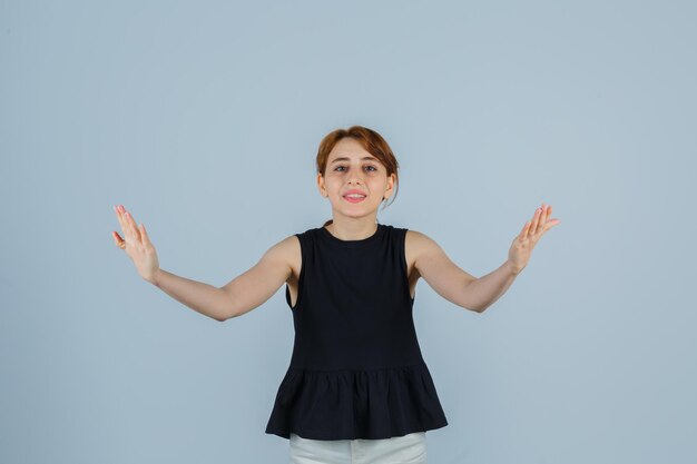 Expressive young lady posing in the studio