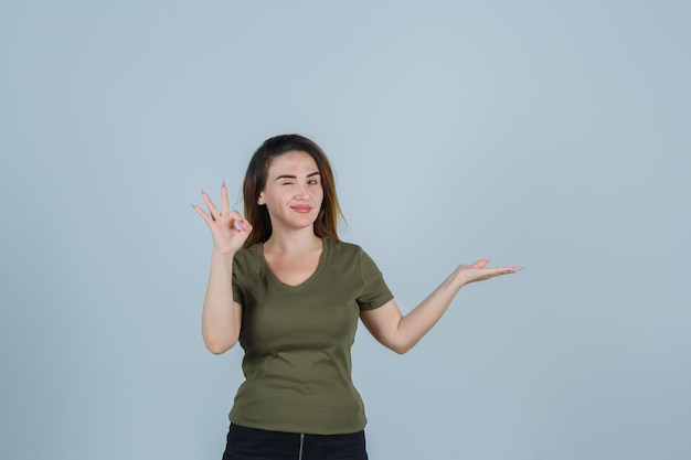 Expressive young lady posing in the studio