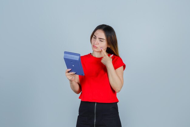 Expressive young lady posing in the studio