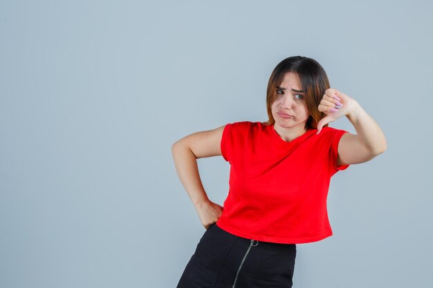 Expressive young lady posing in the studio