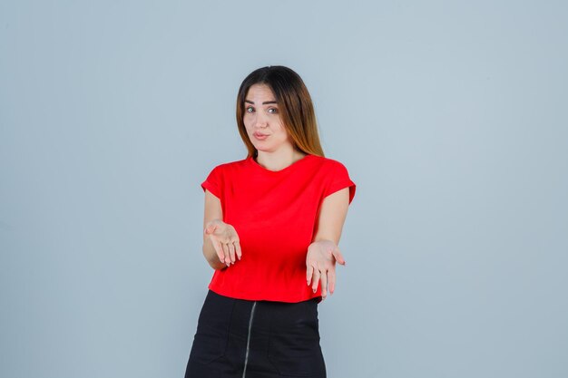 Expressive young lady posing in the studio