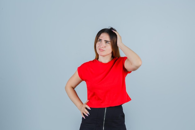 Expressive young lady posing in the studio