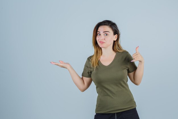 Expressive young lady posing in the studio