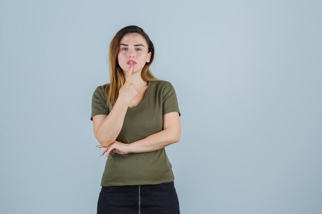 Expressive young lady posing in the studio