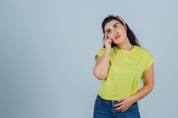 Expressive young lady posing in the studio