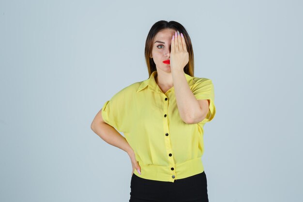 Expressive young lady posing in the studio