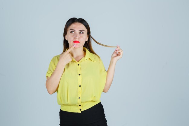 Expressive young lady posing in the studio