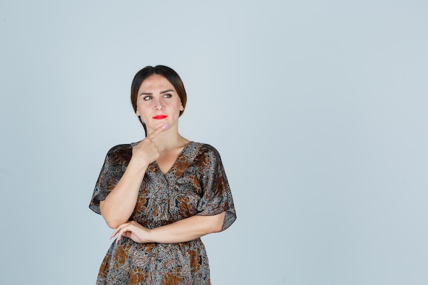 Expressive young lady posing in the studio