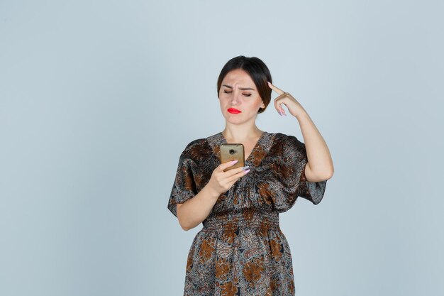 Expressive young lady posing in the studio