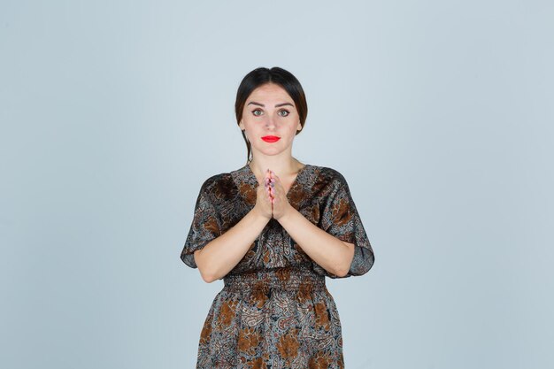 Expressive young lady posing in the studio