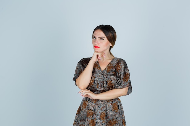 Expressive young lady posing in the studio