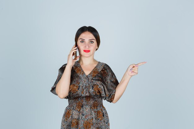 Expressive young lady posing in the studio