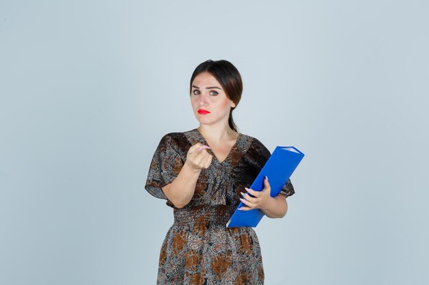 Expressive young lady posing in the studio