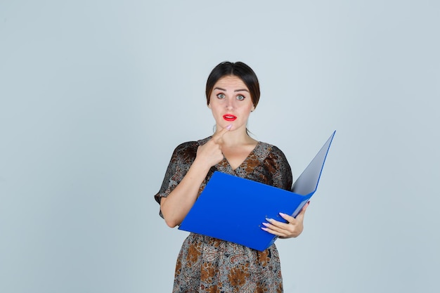 Expressive young lady posing in the studio