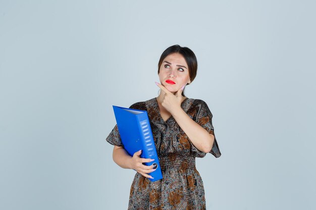 Expressive young lady posing in the studio