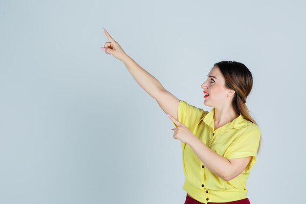 Expressive young lady posing in the studio