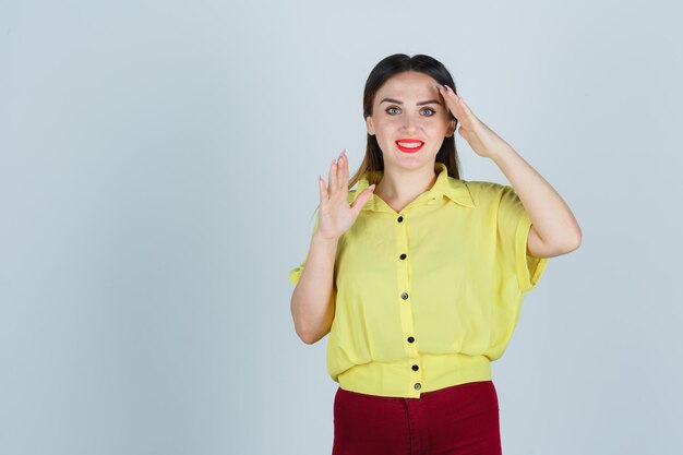 Expressive young lady posing in the studio