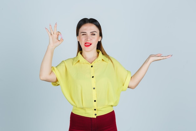 Expressive young lady posing in the studio