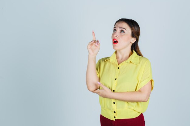 Expressive young lady posing in the studio