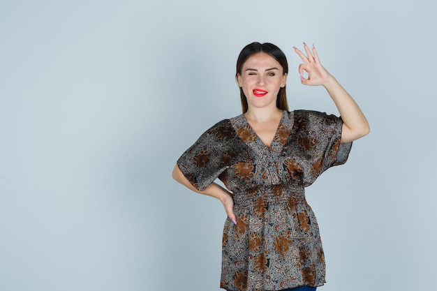 Expressive young lady posing in the studio