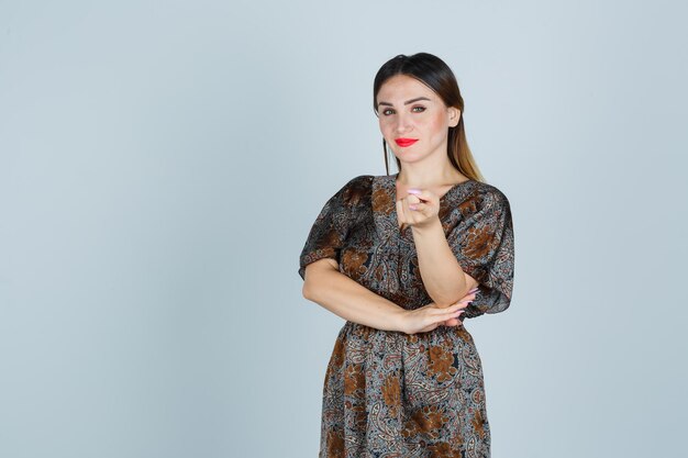 Expressive young lady posing in the studio