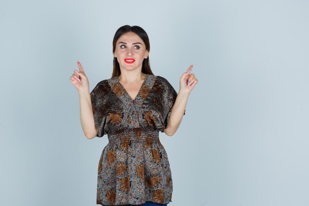 Expressive young lady posing in the studio