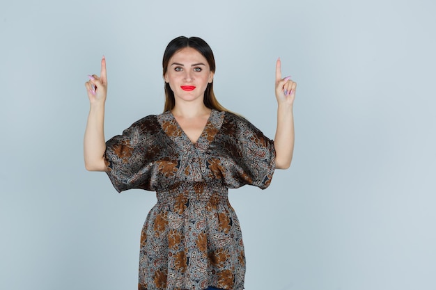 Expressive young lady posing in the studio