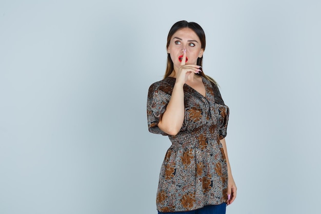 Expressive young lady posing in the studio