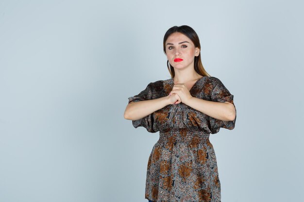 Expressive young lady posing in the studio