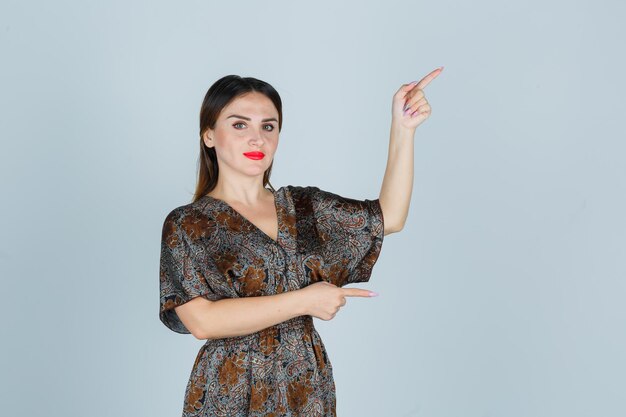 Expressive young lady posing in the studio