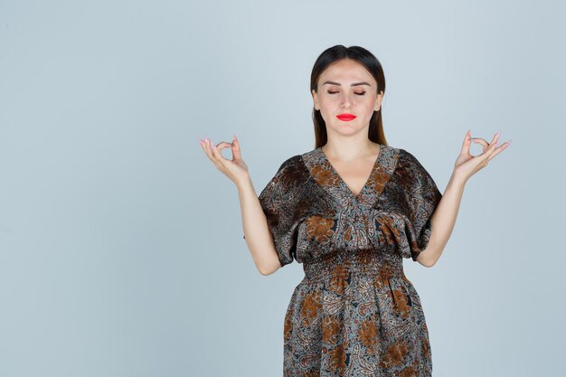 Expressive young lady posing in the studio