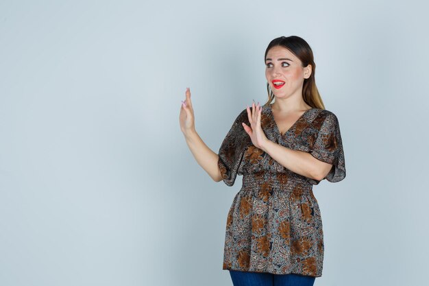 Expressive young lady posing in the studio