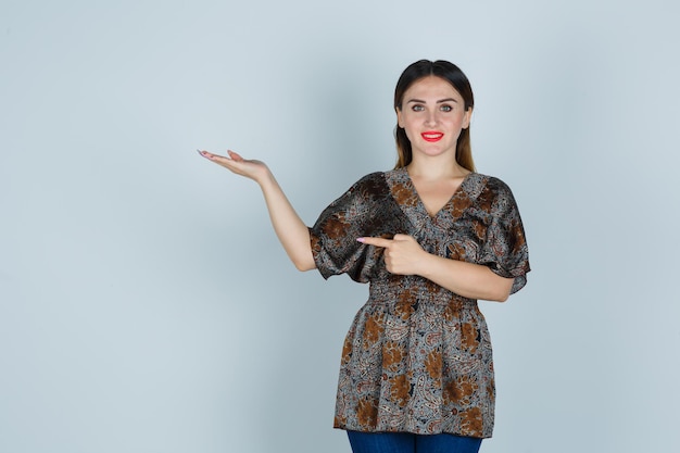 Expressive young lady posing in the studio